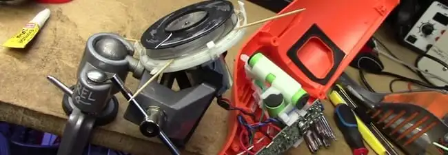 Vacuum cleaner repair parts and tools on a workbench in Kansas City, KS